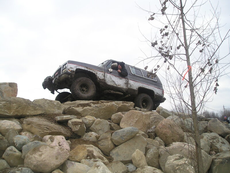 Muddy Suv on Rocks