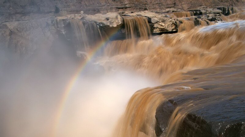 Muddy Waterfall with Rainbow — Brown, Dramatic