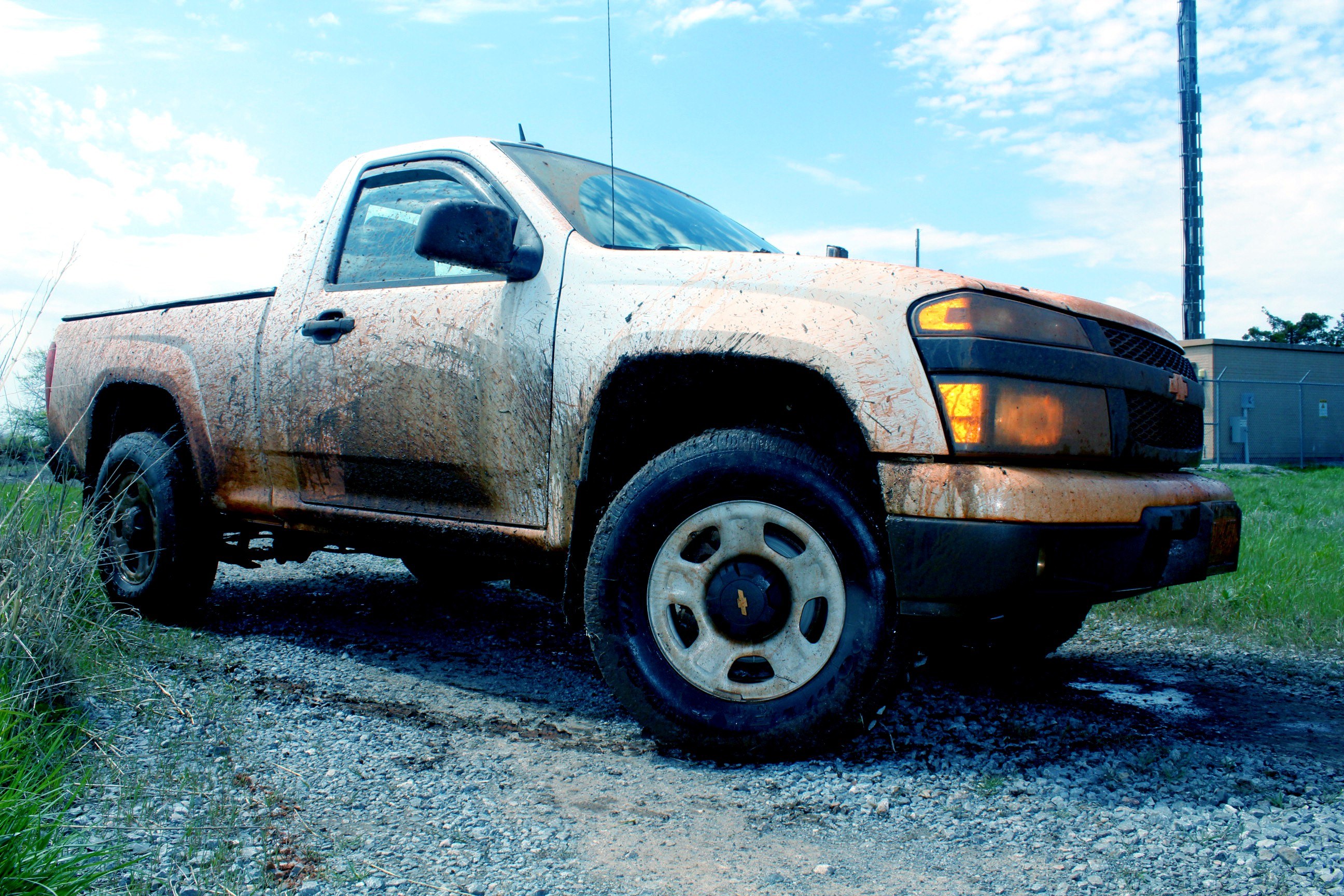 muddy white pickup truck