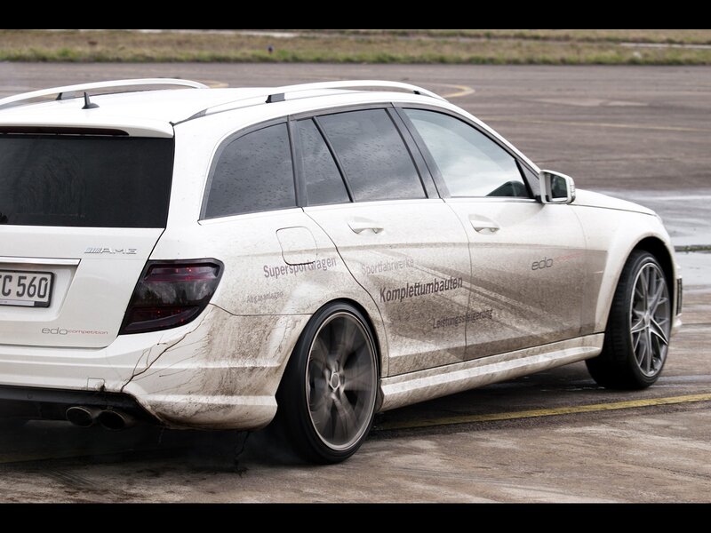 muddy white station wagon
