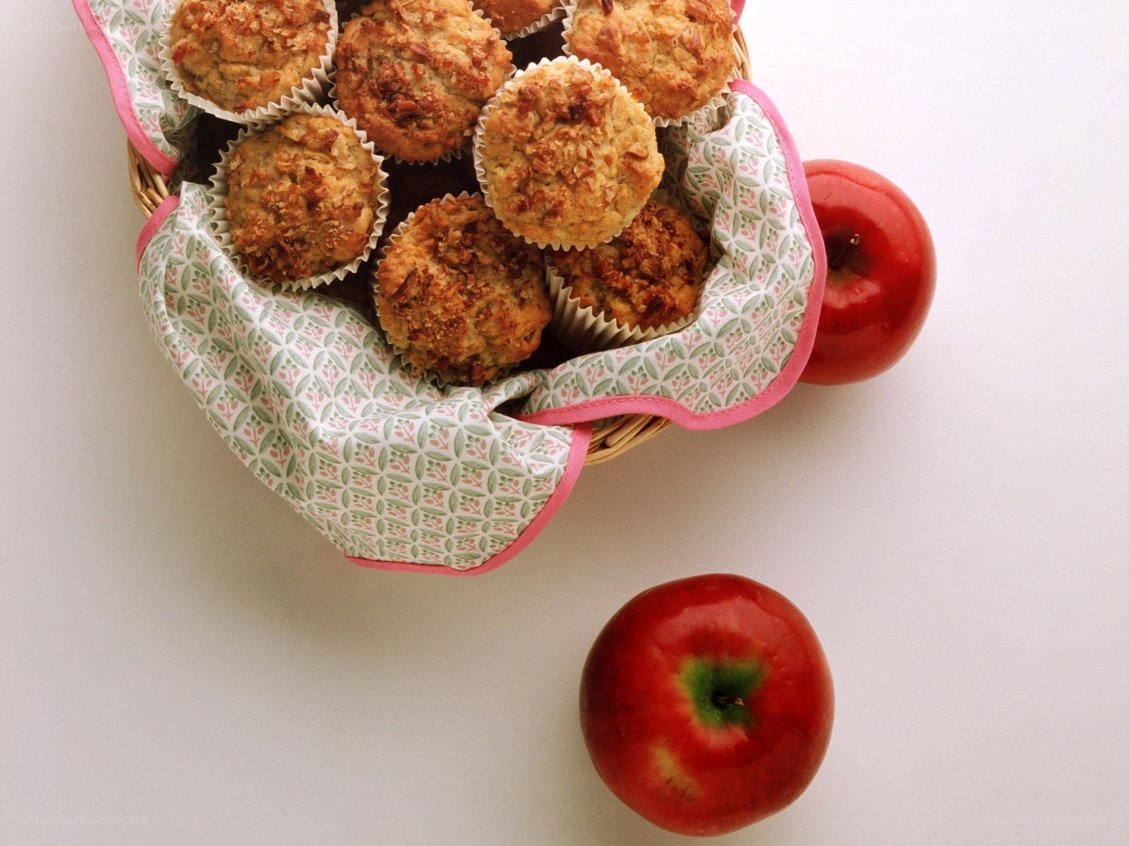 Muffins and apples in a basket
