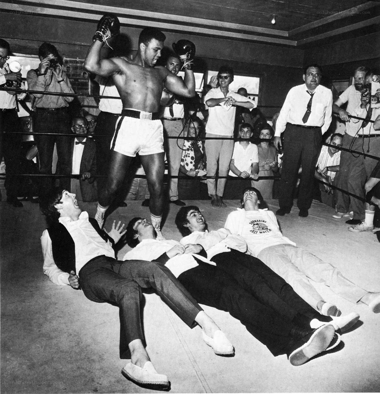 Muhammad Ali celebrates in ring