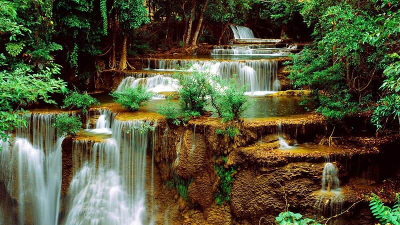 Multi-tiered waterfall in forest