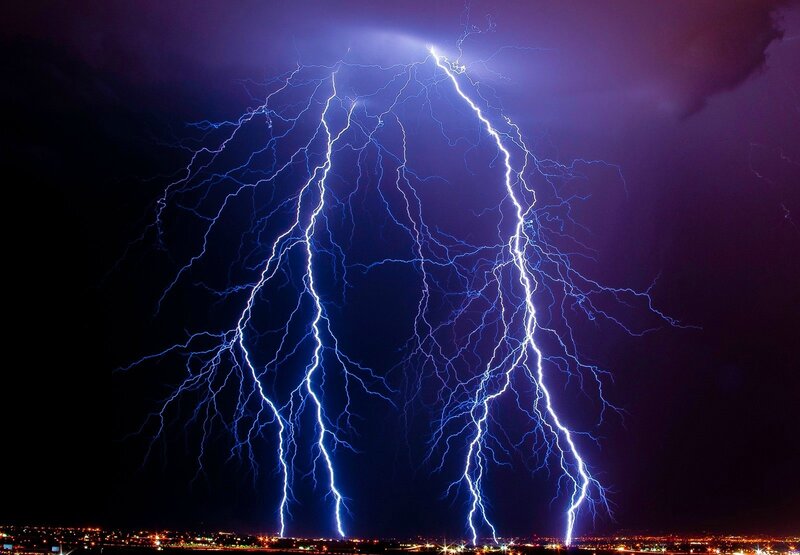 Multiple lightning strikes over city