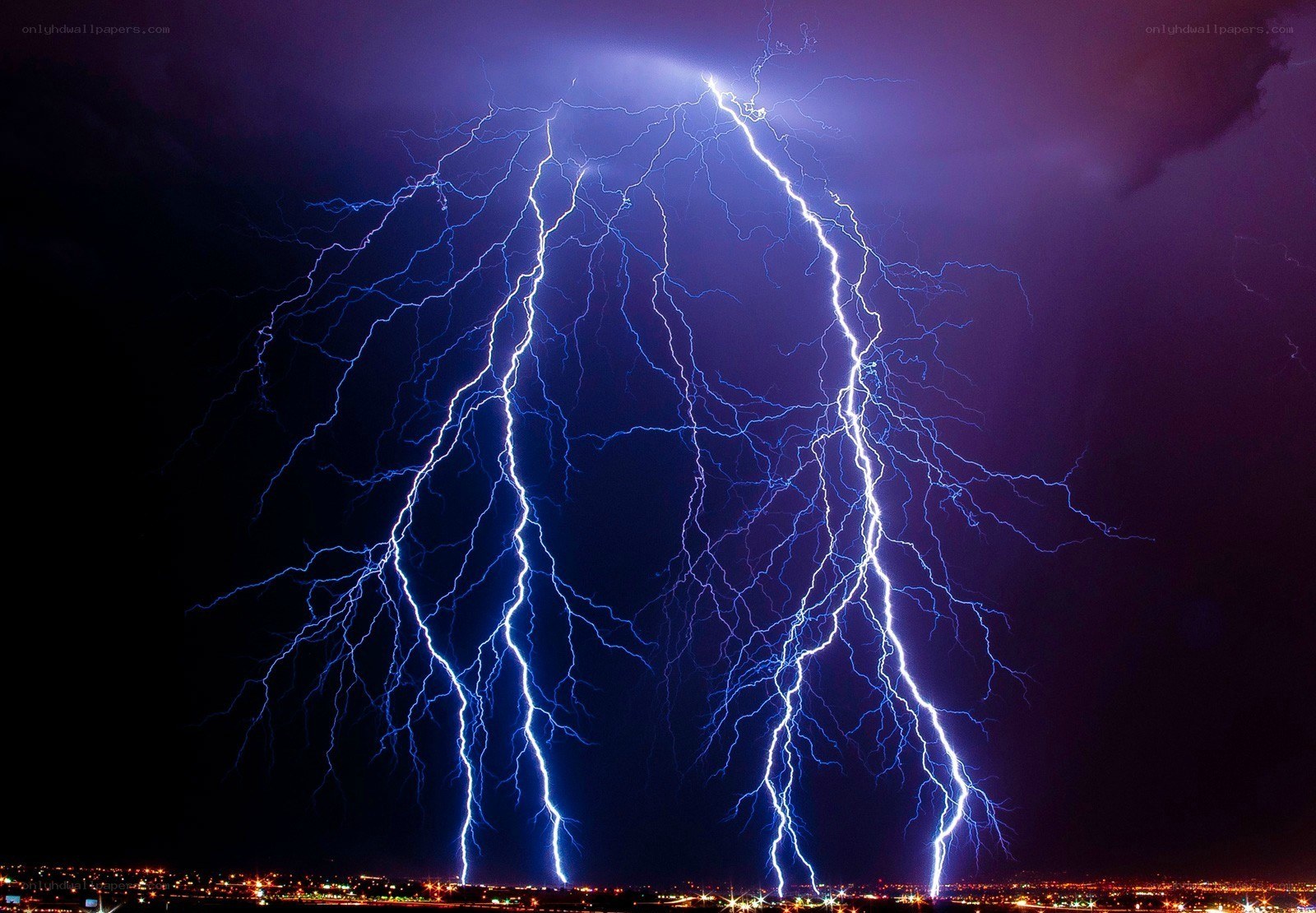Multiple lightning strikes over city