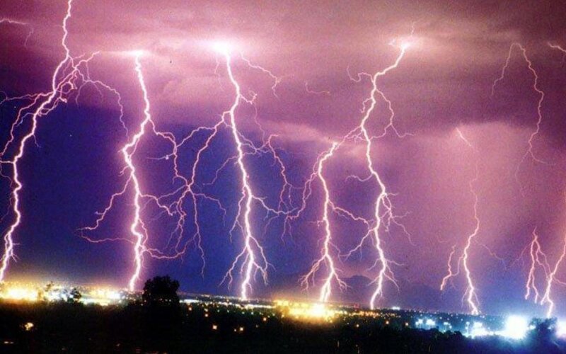 Multiple lightning strikes over city
