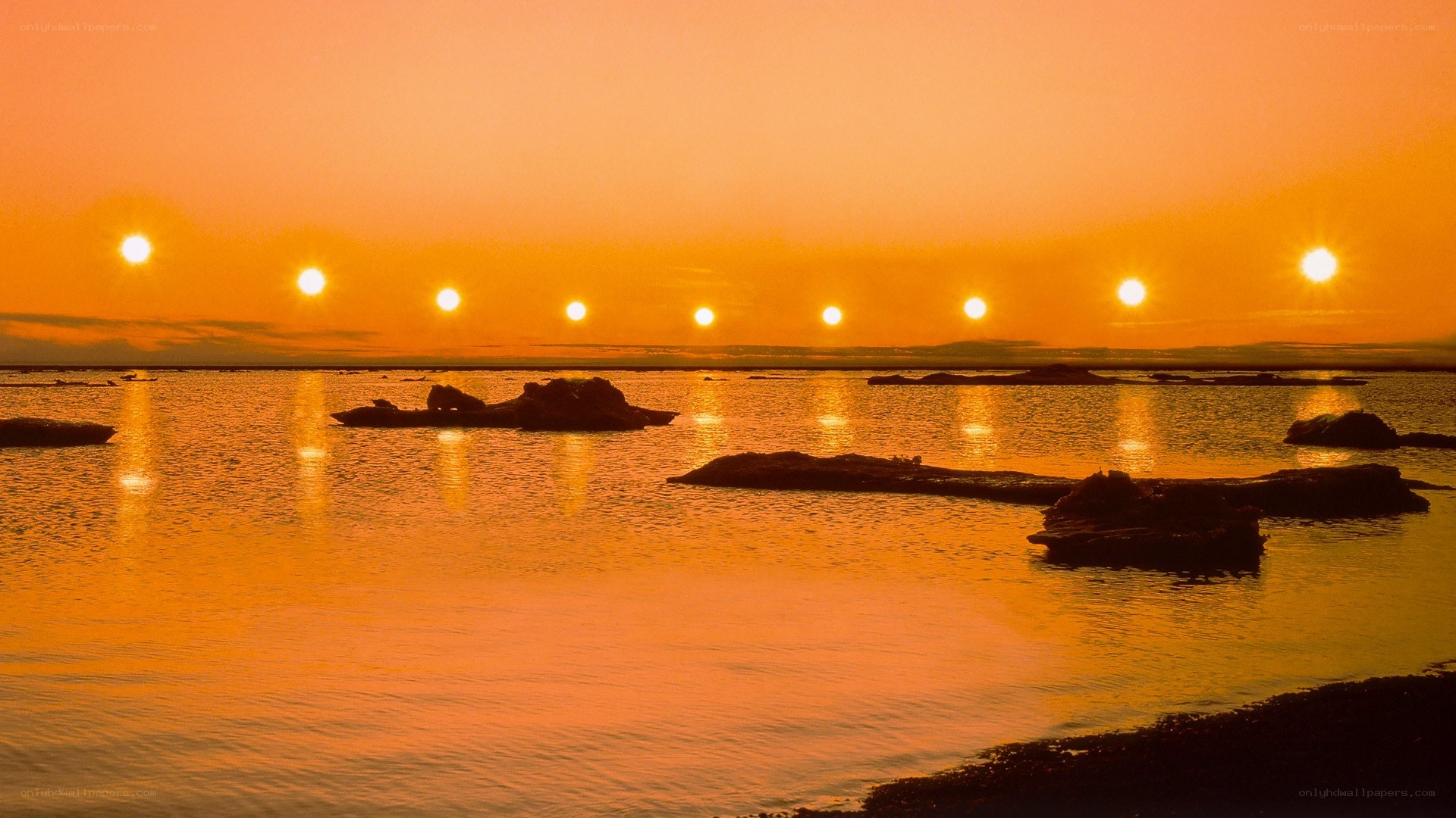 Multiple suns over water