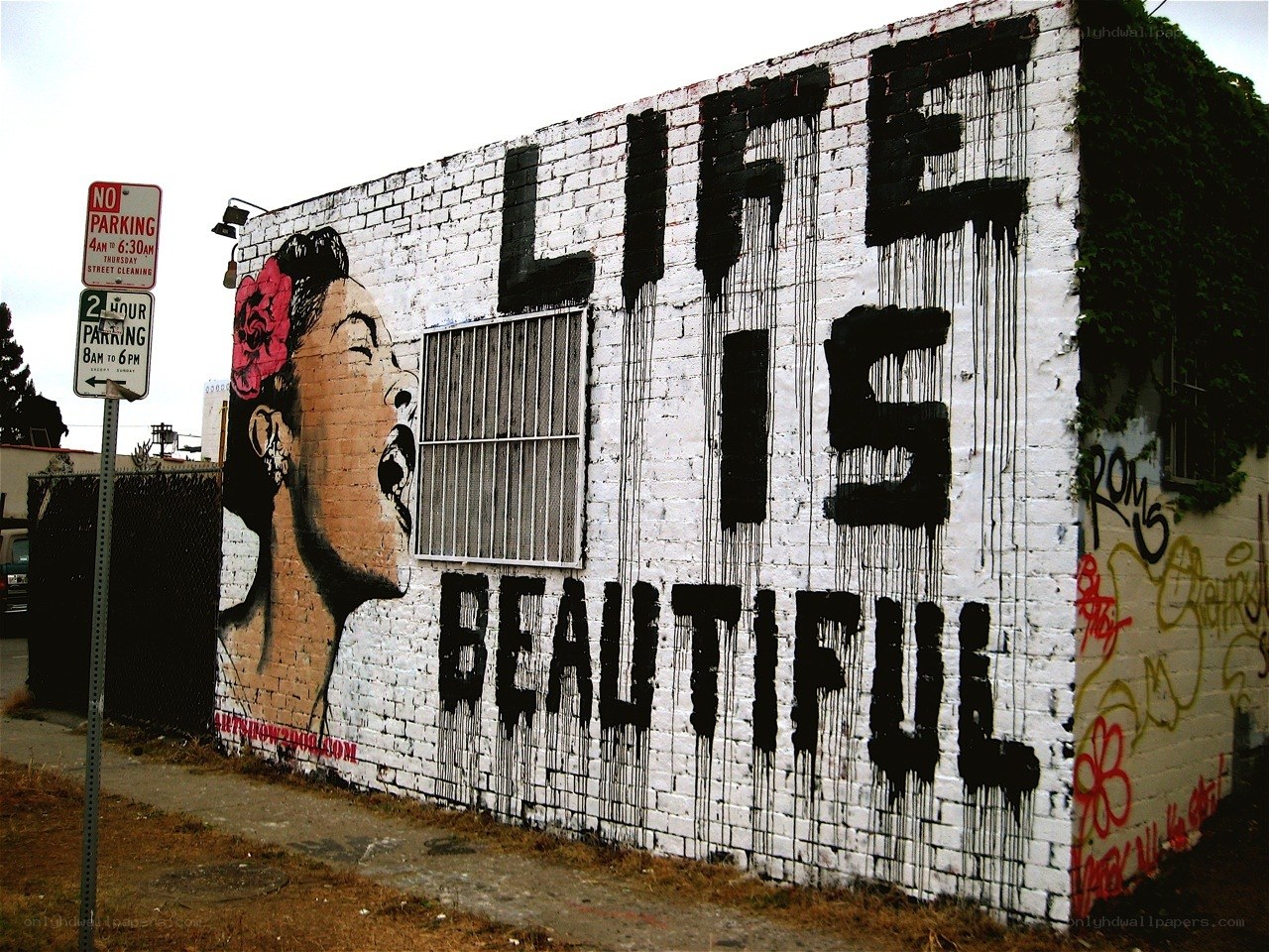 mural with 'life is beautiful' text