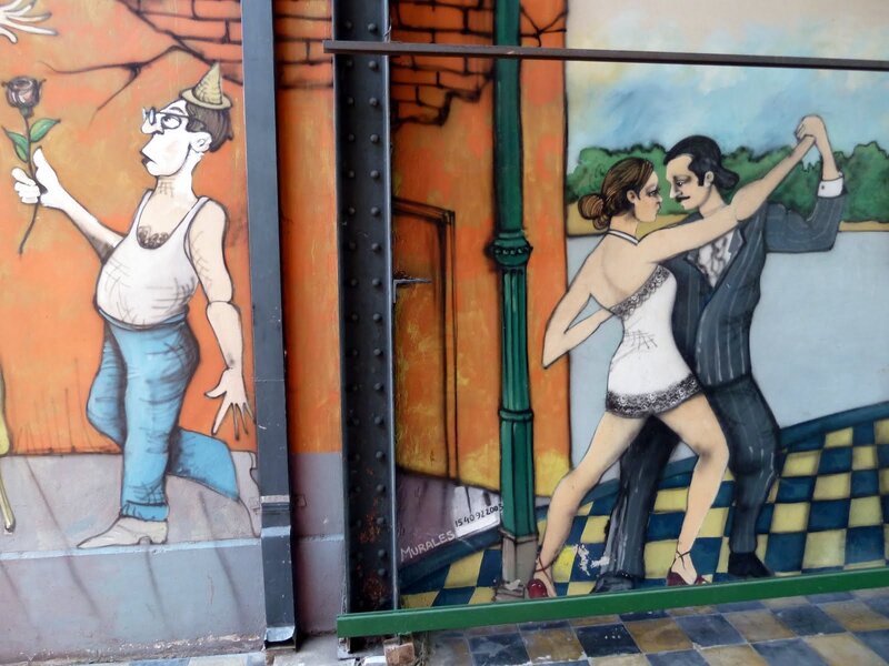 Murals of dancers and a man with rose