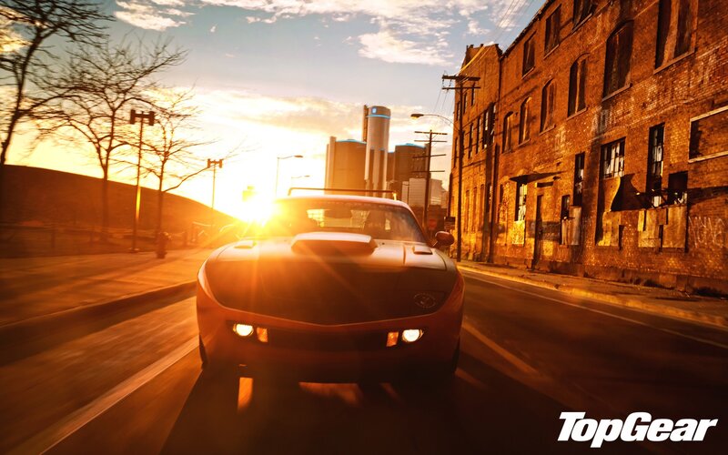 muscle car at sunset in city