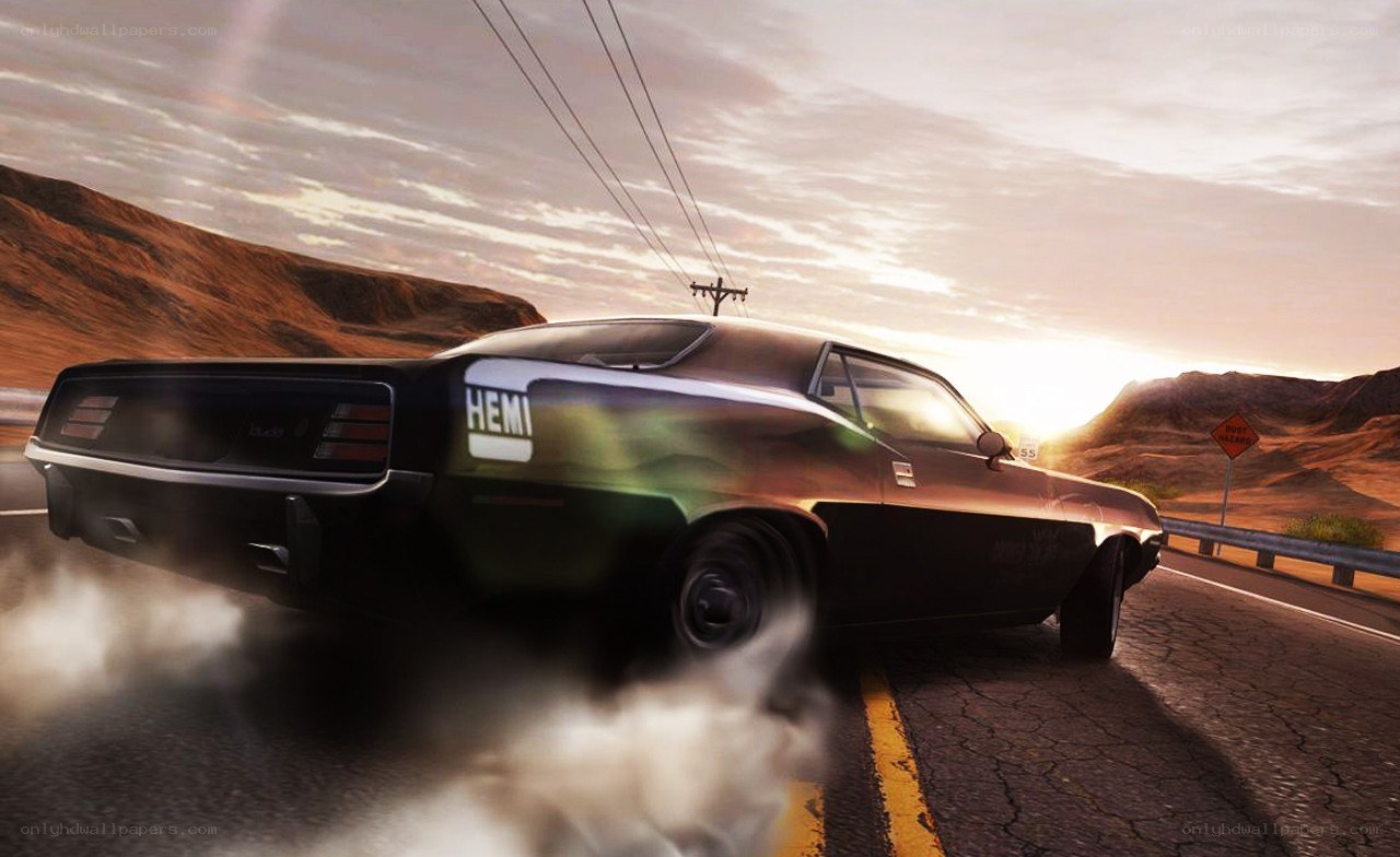 Muscle car drifting at sunset