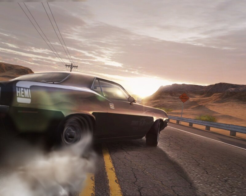 Muscle car drifting on desert road