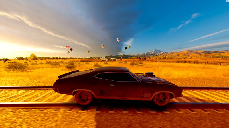 Muscle Car on Train Tracks — Orange