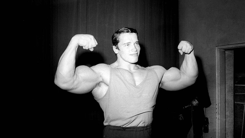 Muscular Man Flexing — Black, Dramatic