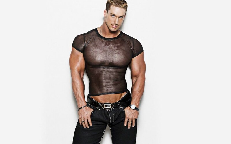 muscular man in sheer top