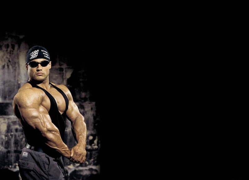 Muscular Man Posing — Black, Dramatic