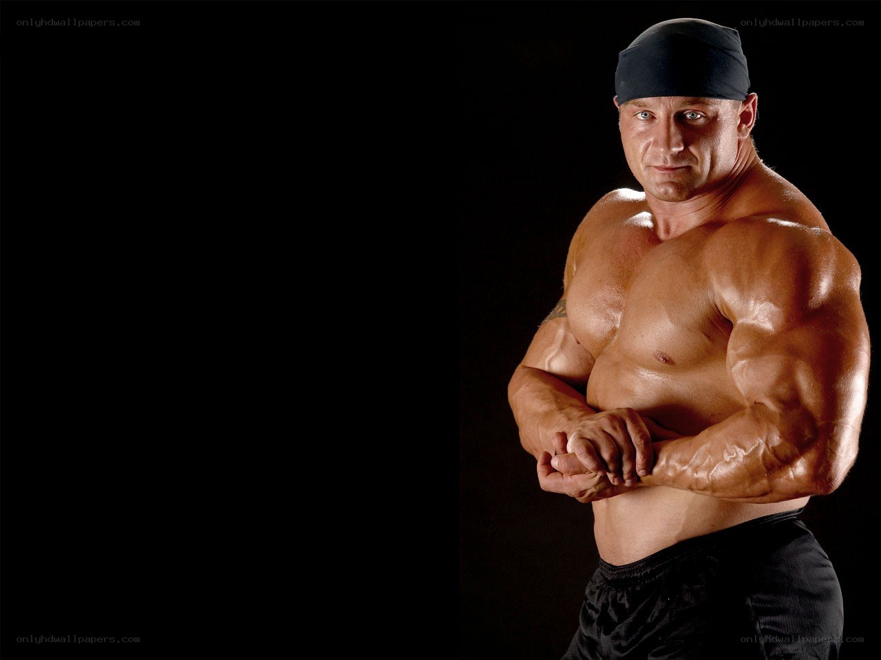 muscular man posing shirtless