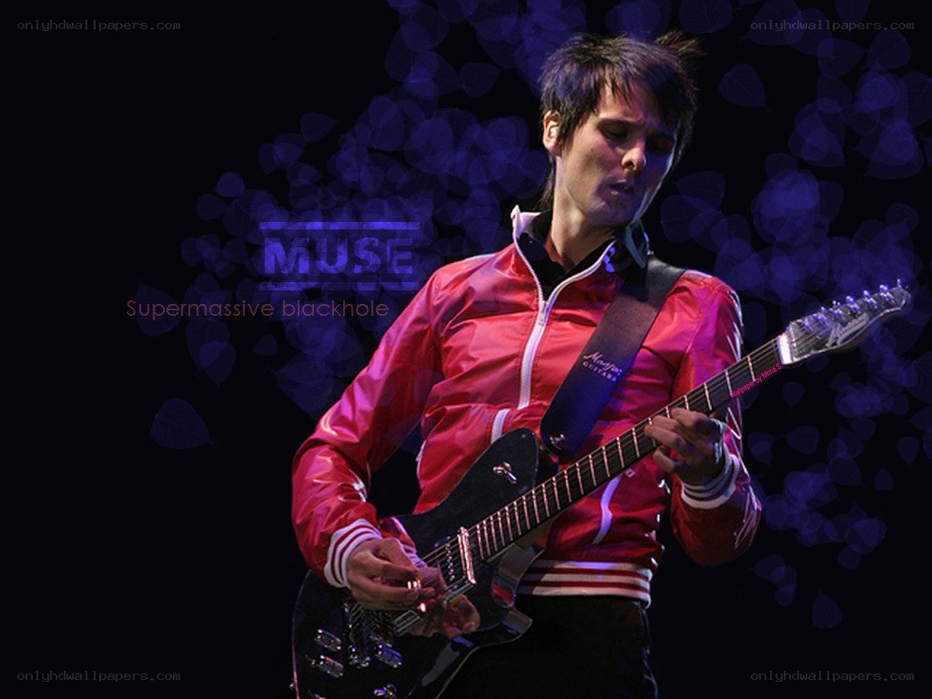 Muse guitarist performing