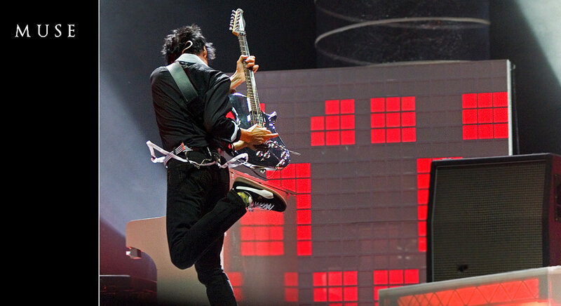 Muse guitarist performing on stage