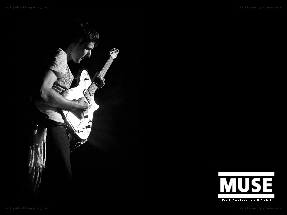 Muse guitarist performing on stage