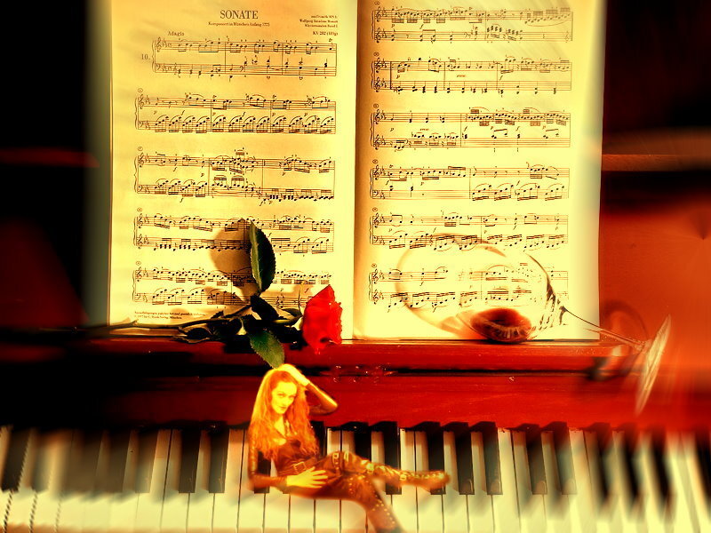 Music and rose on piano