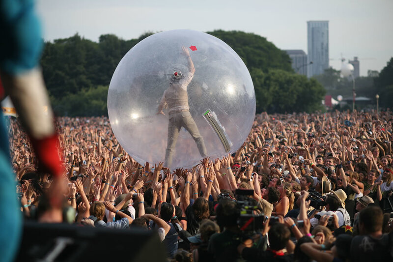Music festival crowd with performer in bubble