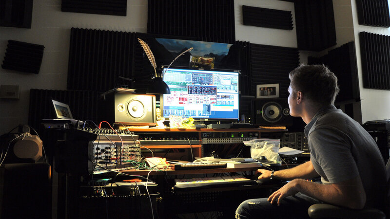 Music producer at workstation