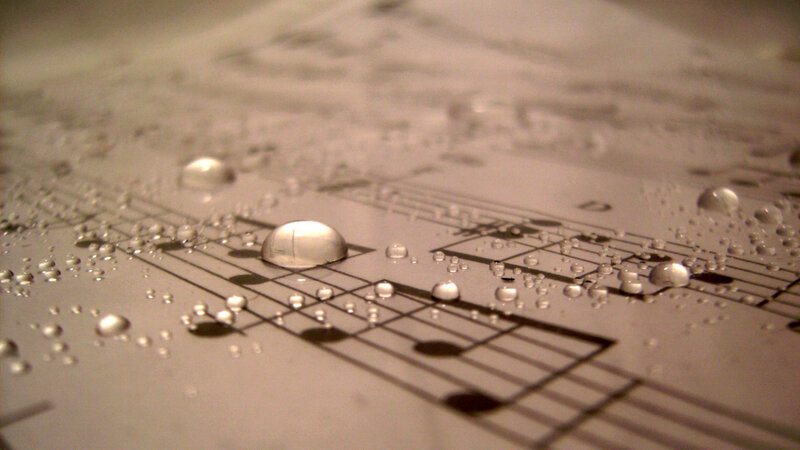 Music Sheet with Water Droplets