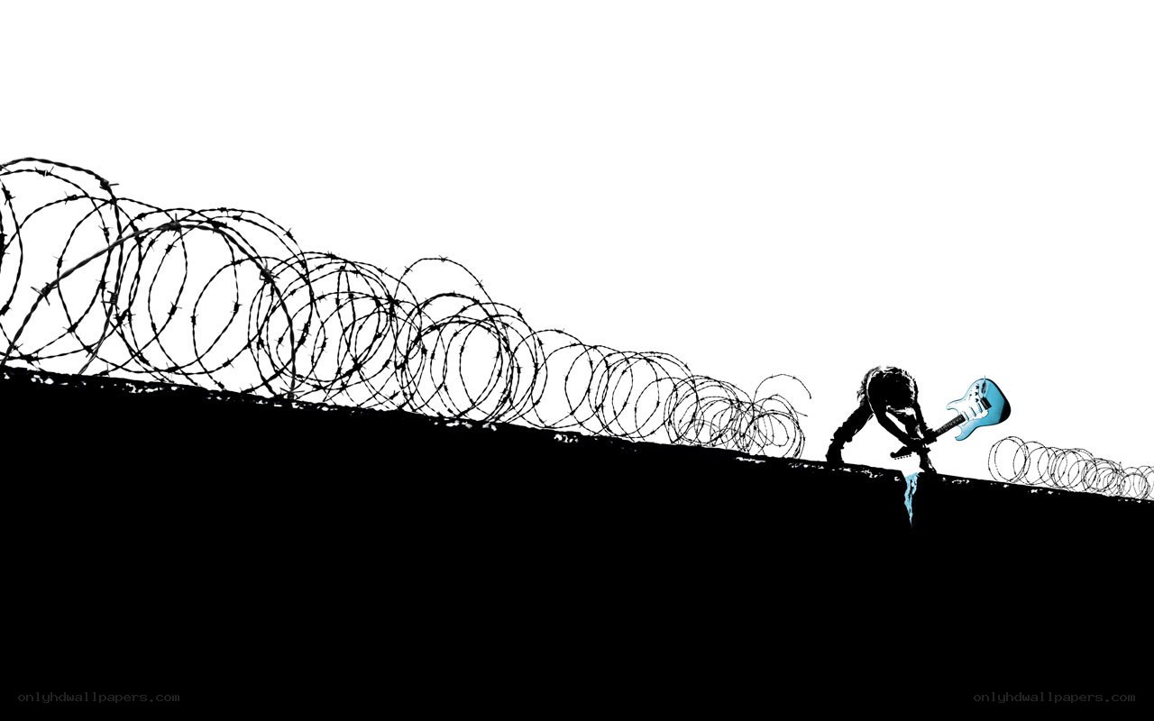 Musician climbing barbed wire