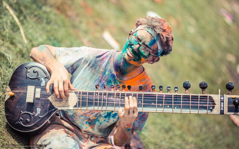 Musician covered in colorful powder