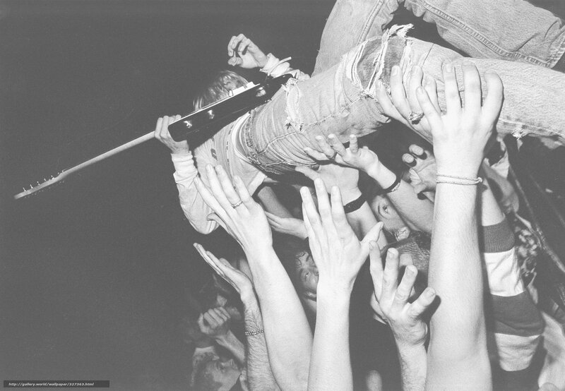 Musician crowd-surfing at concert