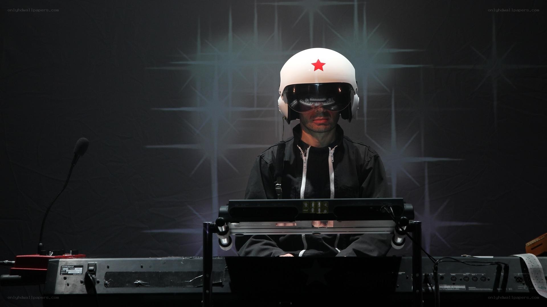 musician in helmet at keyboard