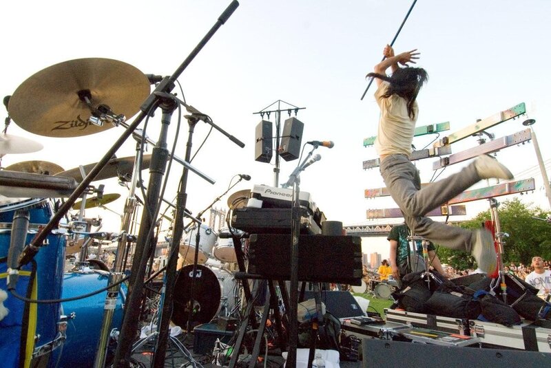 Musician jumping on stage