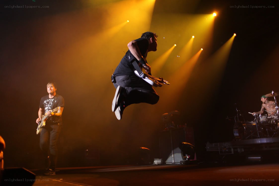 Musician jumping on stage