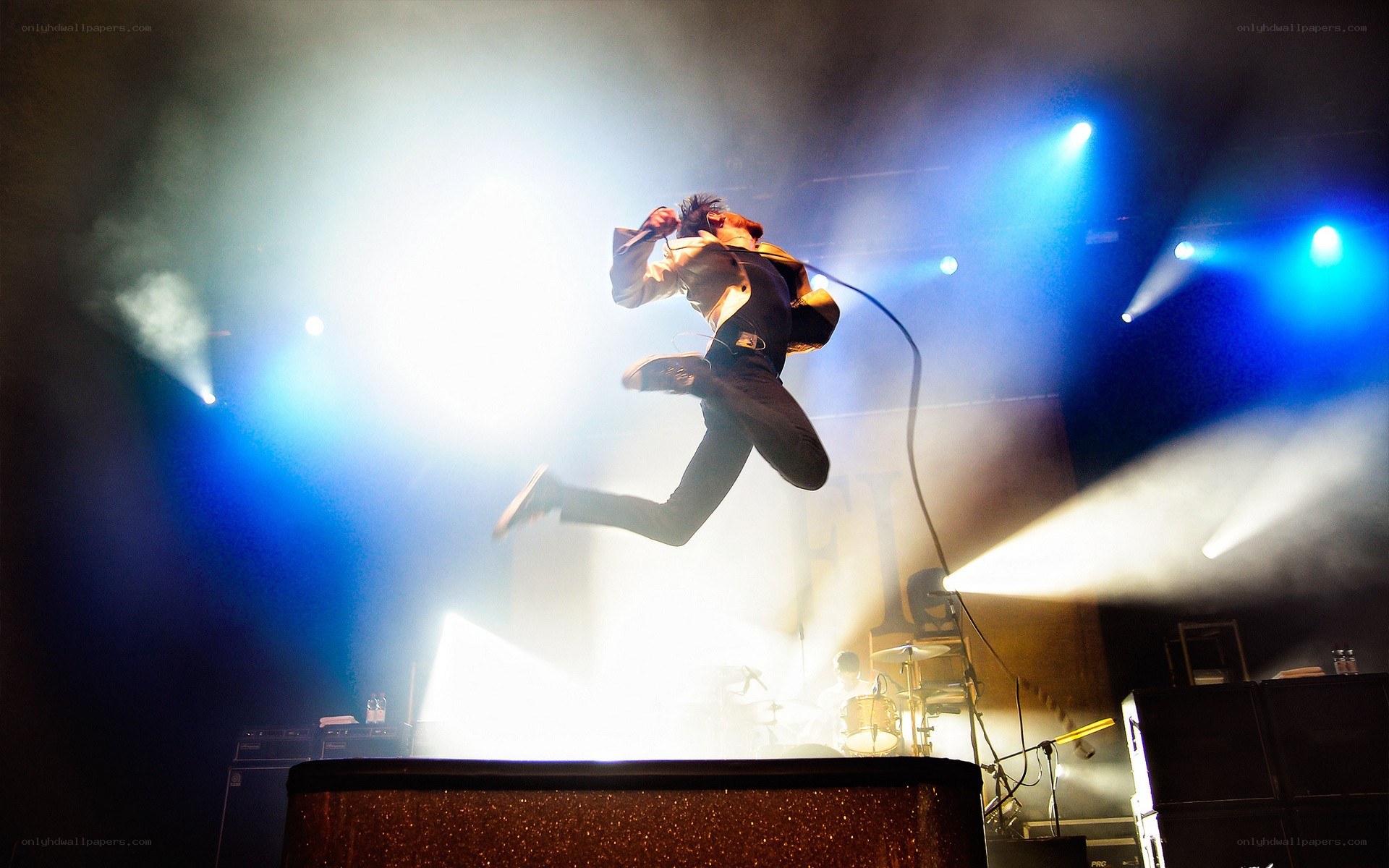 Musician jumping on stage