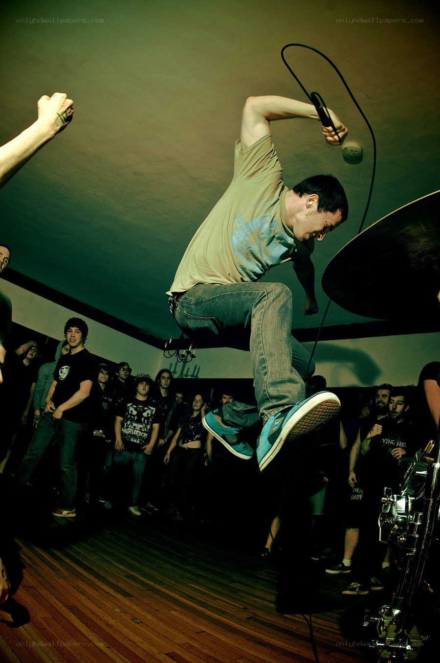 Musician jumping on stage