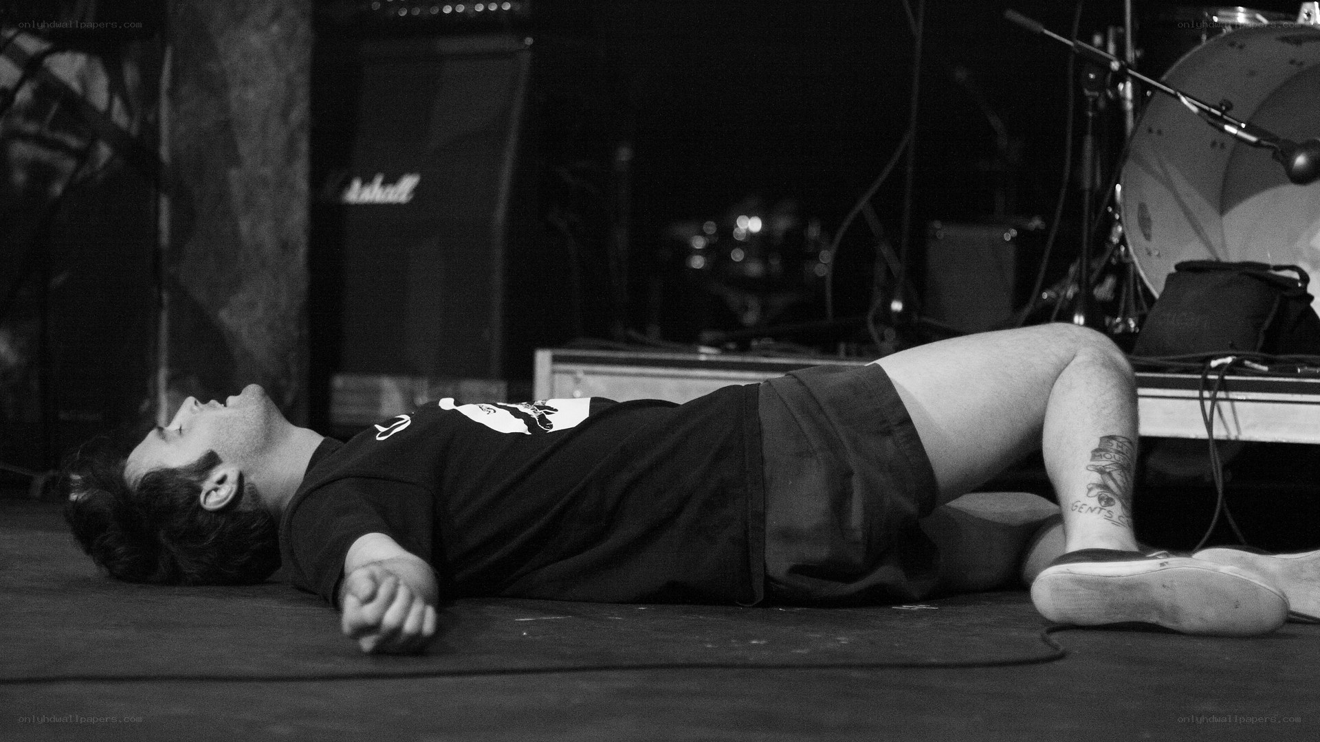 Musician lying on stage