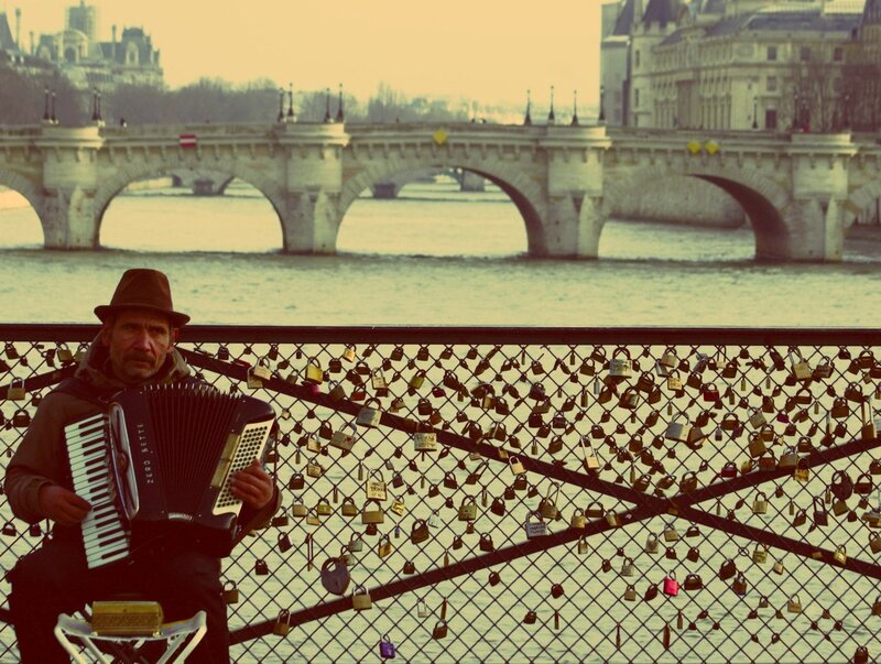 Musician on a bridge in Paris