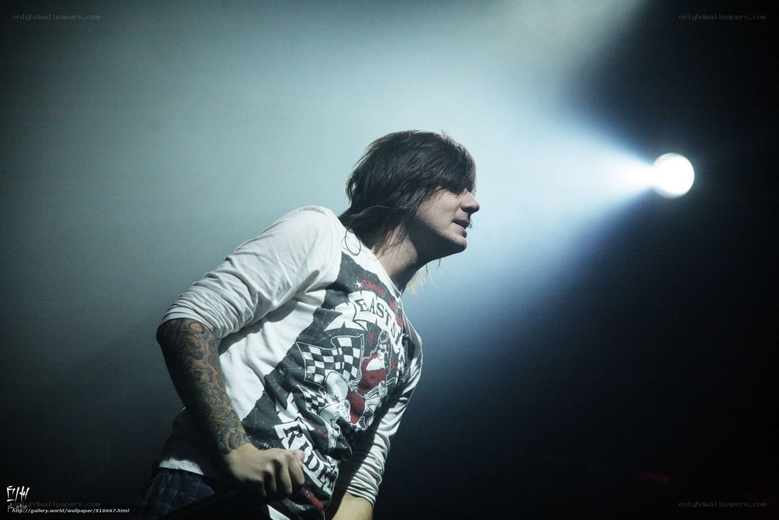 musician on stage under spotlight
