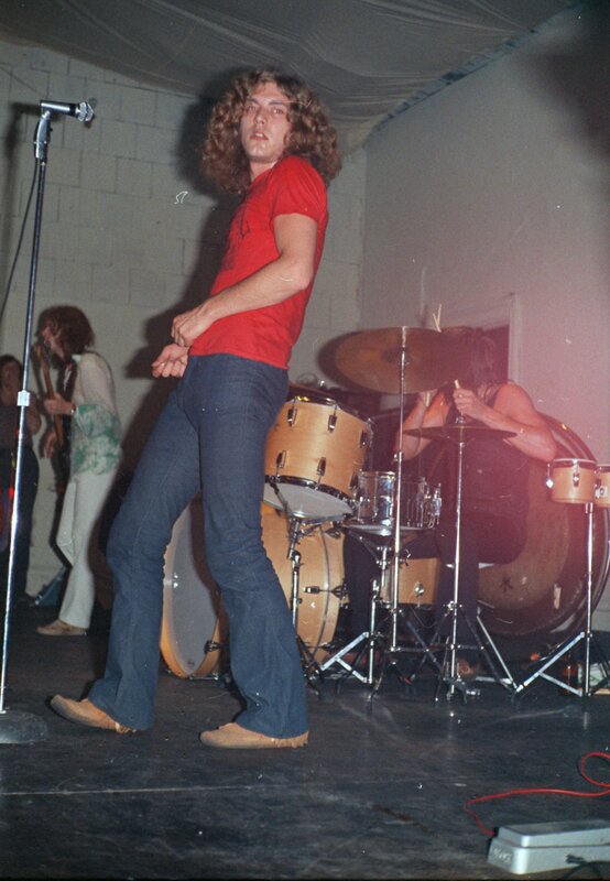 Musician on stage with band