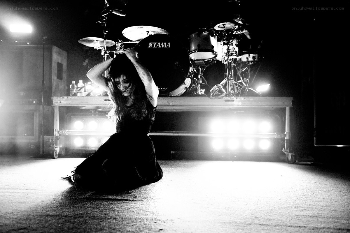 Musician on stage with drum kit