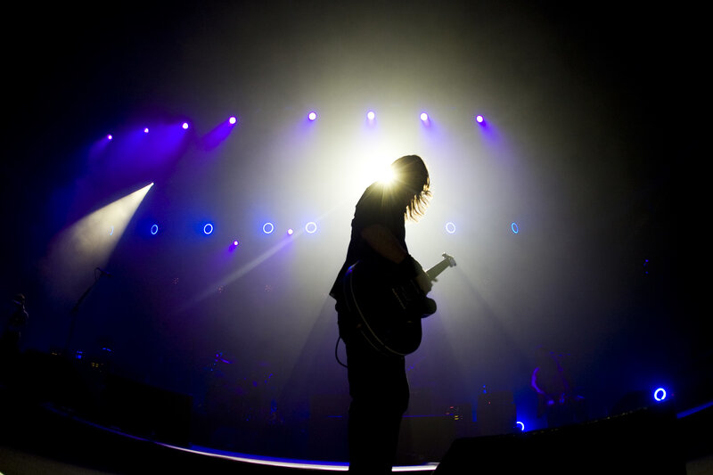 Musician on stage with guitar
