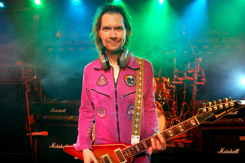 Musician on stage with guitar