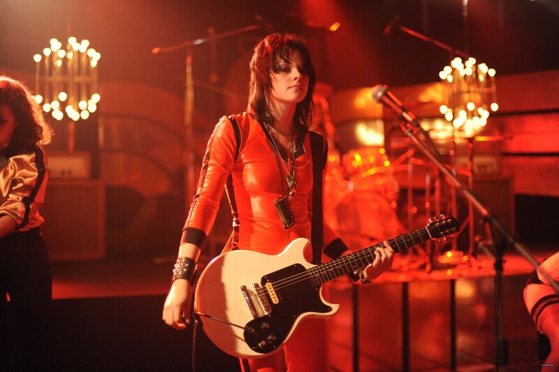 Musician on stage with guitar