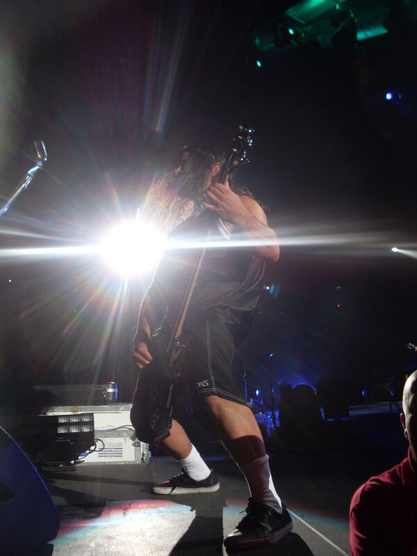 Musician on stage with guitar