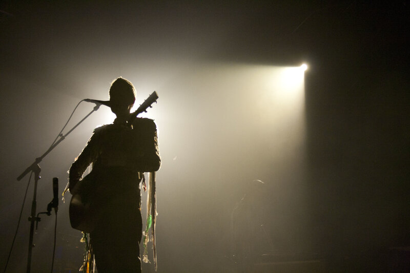 Musician on stage with guitar