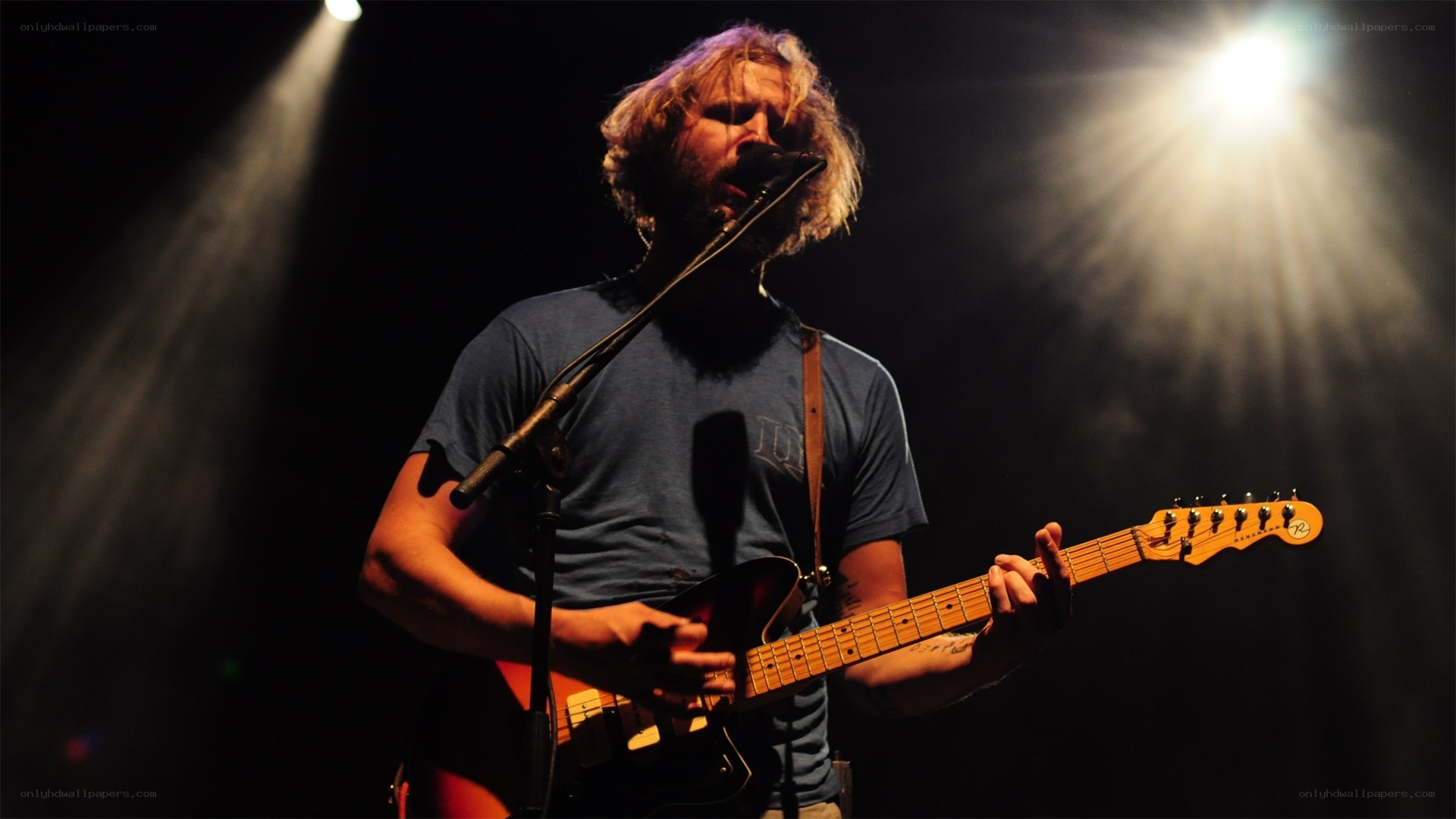 musician performing on stage