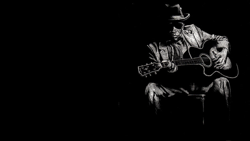 musician playing acoustic guitar