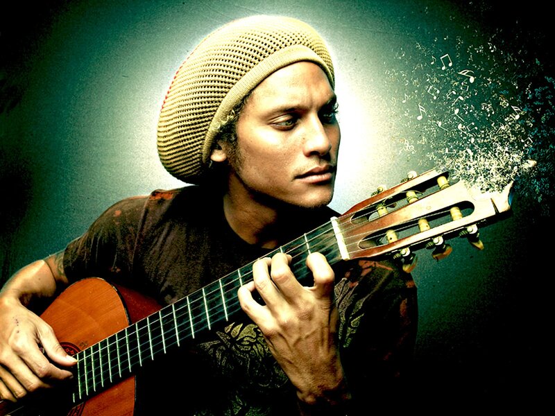 Musician playing acoustic guitar