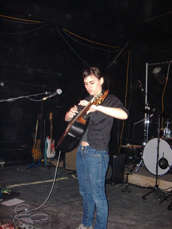 Musician playing acoustic guitar